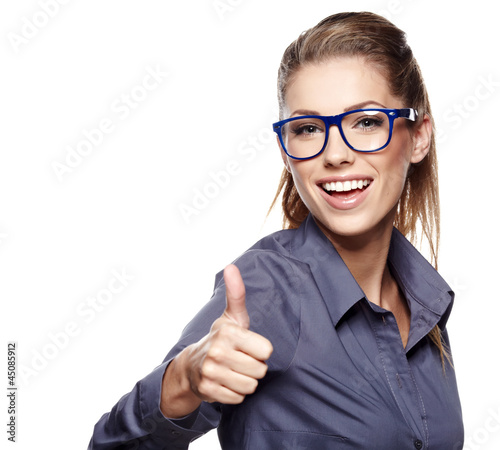 Photo: Happy smiling business woman with thumbs up gesture Happy smiling business woman with thumbs up gesture