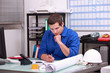 Manual worker completing paperwork