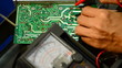 Electrical is testing with voltmeter for repair