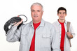 An experienced tradesman posing with his new apprentice