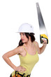 sexy craftswoman holding a handsaw