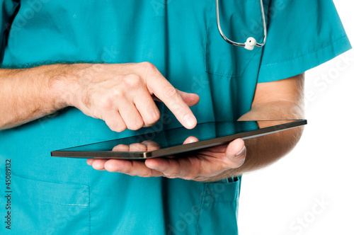 Photo: doctor working on a tablet doctor working on a tablet