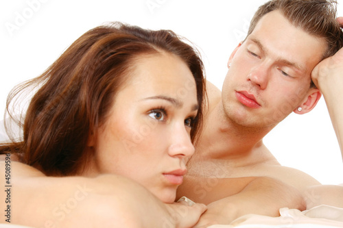 Photo: Loving affectionate nude heterosexual couple on bed Loving affectionate nude heterosexual couple on bed