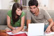 Young couple using a laptop computer