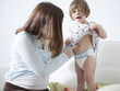 "USA, California, San Francisco, girl (2-3) with mother touching her belly"