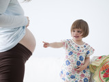 Photo: "USA, California, San Francisco, little girl (2-3) touching pregnant mother's belly" "USA, California, San Francisco, little girl (2-3) touching pregnant mother's belly"
