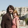 "USA, California, San Francisco, young couple standing together and smiling"