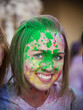 Photo : Portrait of young woman with face covered by paint Portrait of young woman with face covered by paint