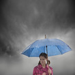 Foto: "USA, Utah, Orem, woman with umbrella standing in rain" "USA, Utah, Orem, woman with umbrella standing in rain"