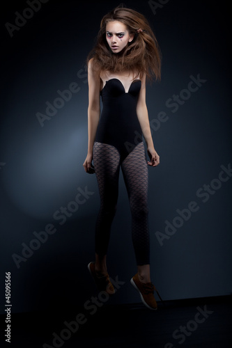 Photo: Beauty fashion woman body over black background Beauty fashion woman body over black background