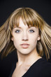 Photo: Studio portrait of young woman Studio portrait of young woman