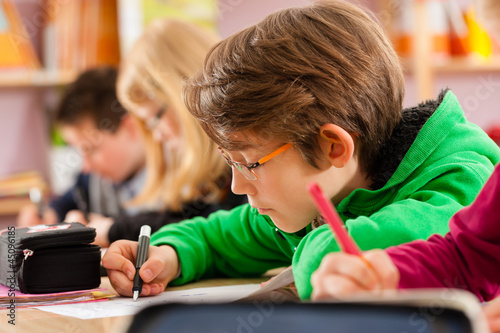 Photo: Pupils at school doing their homework Pupils at school doing their homework