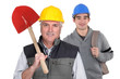 Experienced tradesman standing in front of his apprentice