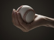 Young woman's hand holding baseball