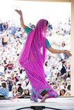 Photo : "USA, Utah, Spanish Fork, rear view of mid adult dancer in traditional clothing performing on stage" "USA, Utah, Spanish Fork, rear view of mid adult dancer in traditional clothing performing on stage"