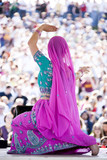 Photo : "USA, Utah, Spanish Fork, rear view of mid adult dancer in traditional clothing performing on stage" "USA, Utah, Spanish Fork, rear view of mid adult dancer in traditional clothing performing on stage"