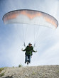 USA, Utah, Lehi, mature man taking off with paraglide, low angle view