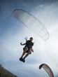 USA, Utah, Lehi, mature man taking off with paraglide, low angle view