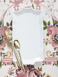 Photo: Empty plate with golden utensils on floral pattern Empty plate with golden utensils on floral pattern