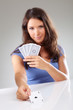 Woman with playing cards,  focus on ace of spades