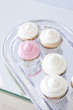 "USA, California, San Francisco, cupcakes with frosting on silver plate"