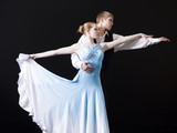 Photo: Young woman posing with teenage boy (16-17) as two professional dancers, studio shot Young woman posing with teenage boy (16-17) as two professional dancers, studio shot
