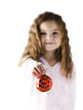 "Girl (6-7) holding Christmas decoration, focus on foreground"