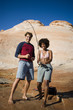 "USA, Utah, Lake Powell, young couple standing and fishing in the lake"
