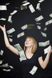 "Portrait of young woman playing with banknotes, digital enhancement"