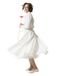 "Happy young woman dancing with gerbera flower, portrait, studio shot"