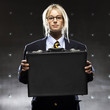 "Successful businesswoman holding suitcase, portrait"