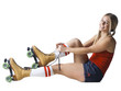 Portrait of young woman tying roller skates