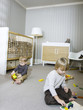 "USA, Utah, Provo, Two boys (18-23 months,2-3) playing in home"