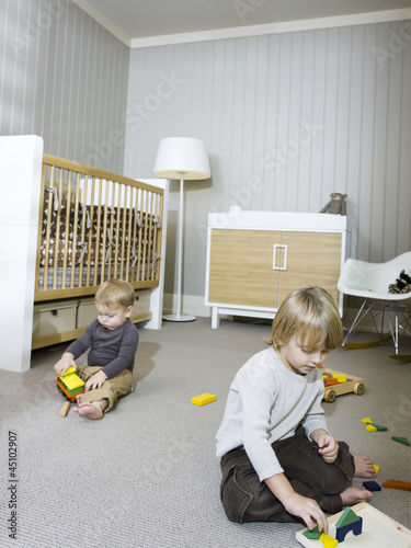 Photo: "USA, Utah, Provo, Two boys (18-23 months,2-3) playing in home" "USA, Utah, Provo, Two boys (18-23 months,2-3) playing in home"