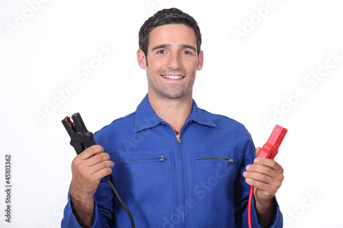 Photo: man car mechanic with alligator clips man car mechanic with alligator clips