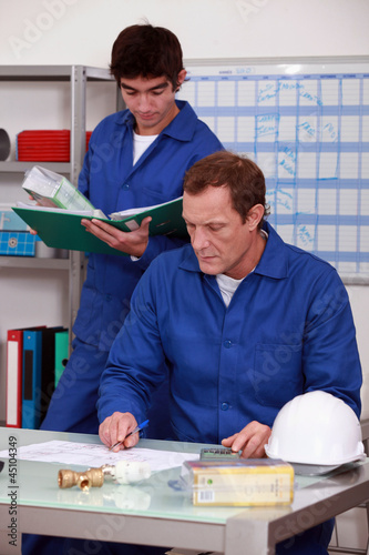 Photo: Manual workers in an office Manual workers in an office