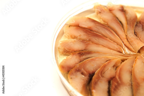 Photo: herring in oil on a white background herring in oil on a white background