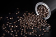 Coffee beans spilling out of pot