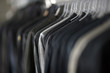 USA, Utah, Salt Lake City, Suits hanging on rail