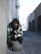 USA, Utah, Salt Lake City, Homeless man with sack by roadside