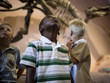 USA, Utah, Lehi, boys (6-9) in museum of dinosaurs