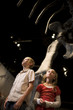 USA, Utah, Lehi, children (8-11) in museum of dinosaurs