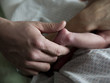 USA, Utah, Payson, Close-up of hand holding newborn's foot