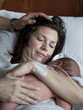 USA, Utah, Payson, Mother embracing newborn baby