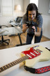 USA, Utah, Orem, Teenage girl (16-17) photographing guitar