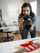USA, Utah, Orem, Portrait of teenage girl (16-17) photographing guitar