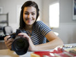 USA, Utah, Orem, Portrait of teenage girl (16-17) holding camera