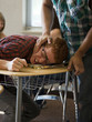 Photo: "USA, Utah, Young man bullying teenage boy (16-17) in classroom" "USA, Utah, Young man bullying teenage boy (16-17) in classroom"