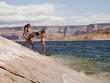 "USA, Utah, Young women standing near Lake Powell"
