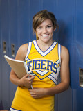 Photo: "USA, Utah, Spanish Fork, Portrait of school girl (16-17) holding notepad by lockers" "USA, Utah, Spanish Fork, Portrait of school girl (16-17) holding notepad by lockers"